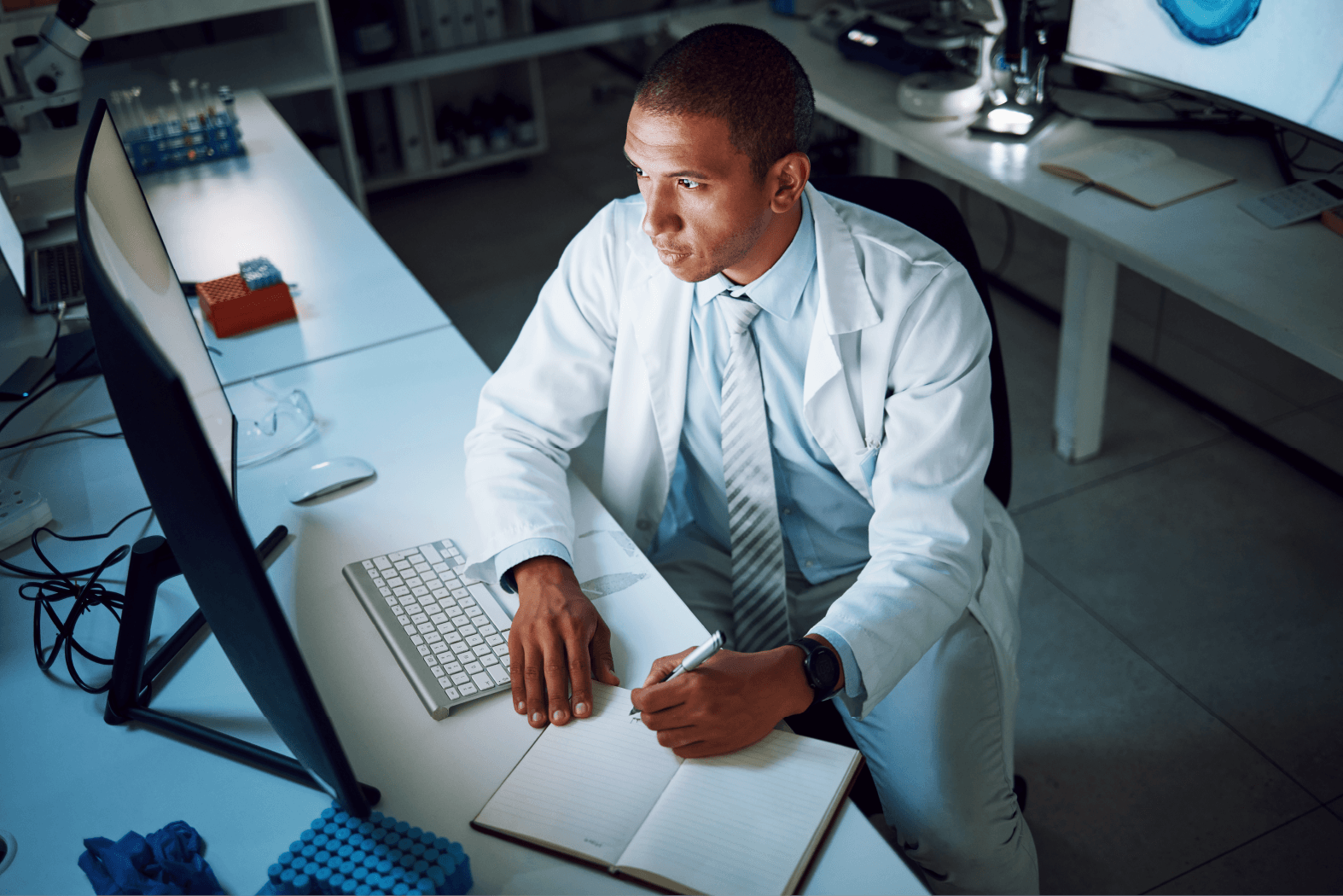 Man writing in notebook
