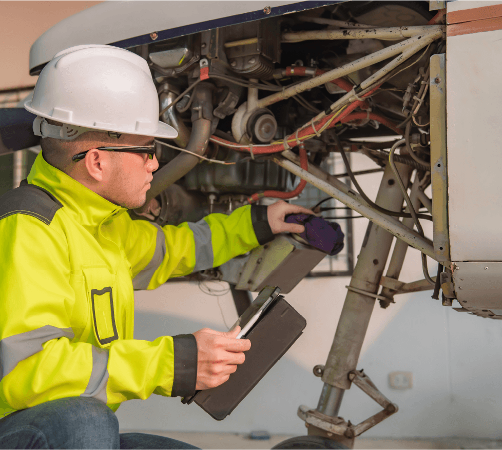 Man repairing aircraft